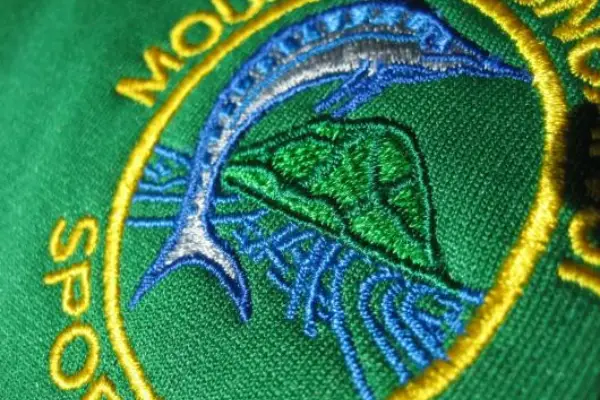close up image of detailed embroidered logo on clothing to show embroidery is available