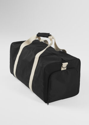 Black duffel bag with beige carrying straps and a front zippered pocket on a light background.