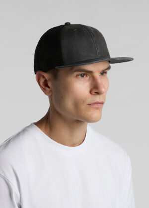 Man wearing a black mesh-back baseball cap in profile view against a gray background, with a white T-shirt.