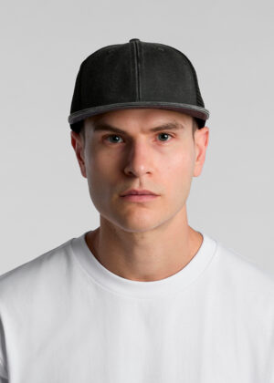 Head-and-shoulders portrait of a man facing the camera, wearing a black cap and a white T-shirt with a neutral expression.