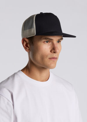 Young man wearing a black trucker cap with a white mesh back and a plain white T-shirt, facing left.