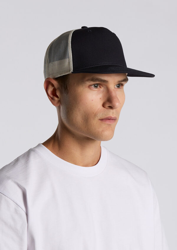 Young man wearing a black trucker cap with a white mesh back and a plain white T-shirt, facing left.