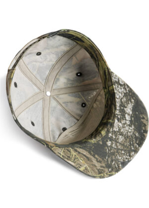 Camouflage baseball cap viewed from above, showing the interior crown and ventilation holes.