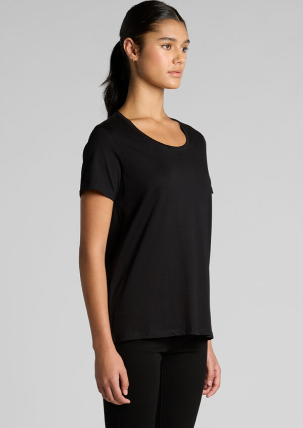 Woman in a black crew-neck T-shirt and black pants, shown in profile view.