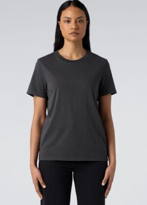 Front view of a woman wearing a plain charcoal gray crew-neck T-shirt with short sleeves, standing against a light background.