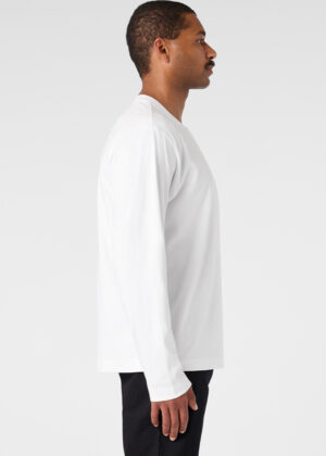 Man in a white long-sleeve shirt shown in profile against a light background.