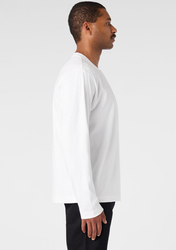 Man in a white long-sleeve shirt shown in profile against a light background.