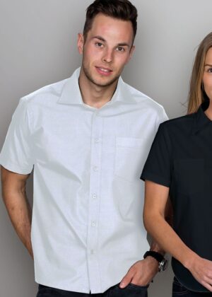 Man wearing a white short-sleeve button-down shirt posing with a woman in a black shirt beside him.