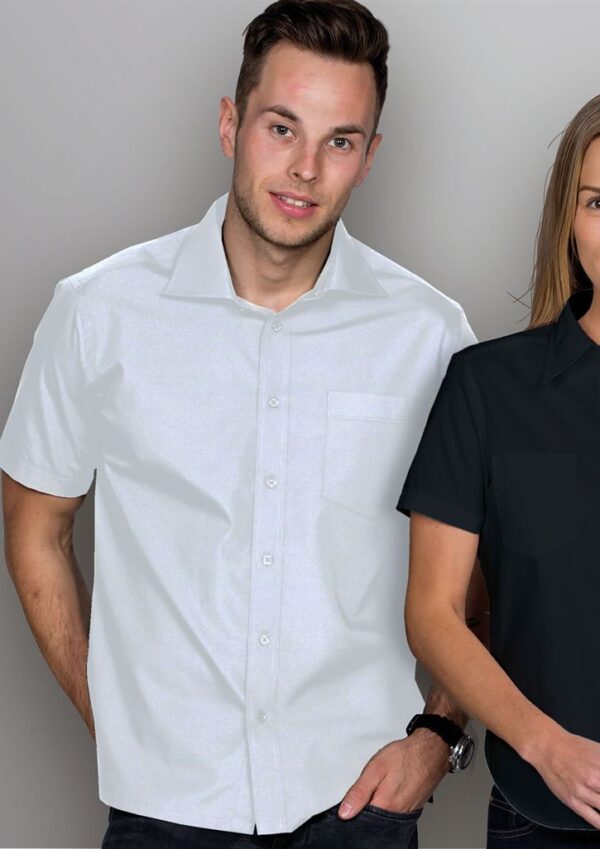bvtl_worn_00 Man wearing a white short-sleeve button-down shirt posing with a woman in a black shirt beside him.