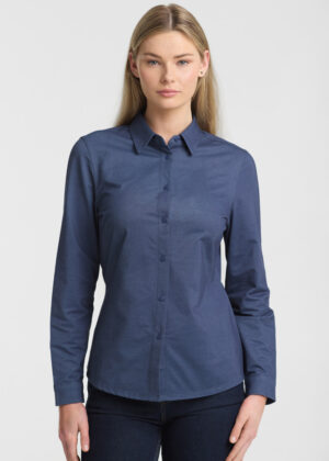 Model wearing a blue button-down shirt with long sleeves against a light gray background, front view.