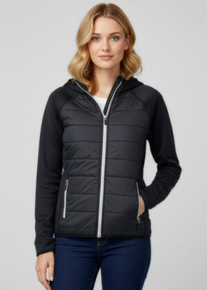Model wearing a two-tone quilted hooded jacket with a front zipper and zip pockets.