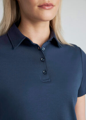 Close-up of a person’s neck and chest wearing a navy polo shirt with a button placket and collar.