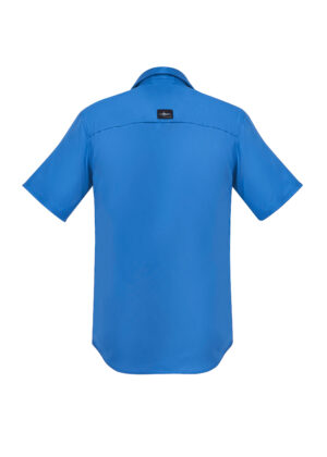 Back view of a bright blue short-sleeve shirt with a small black logo patch on the upper back area