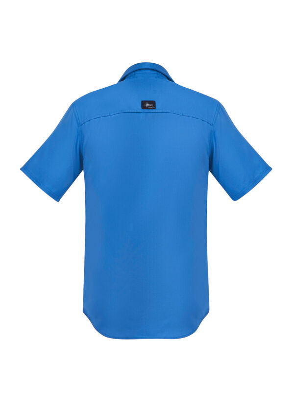 Back view of a bright blue short-sleeve shirt with a small black logo patch on the upper back area