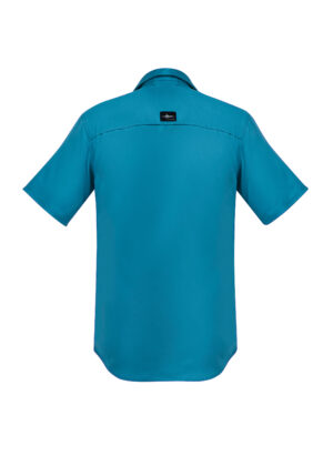 Back view of a teal short-sleeve shirt with a black brand label at the upper back near the yoke.