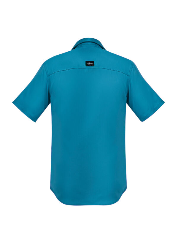 Back view of a teal short-sleeve shirt with a black brand label at the upper back near the yoke.
