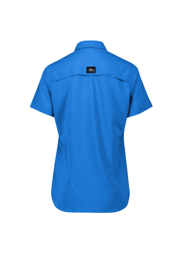 Back view of a bright blue short-sleeve shirt with a small black tag on the upper back yoke area.